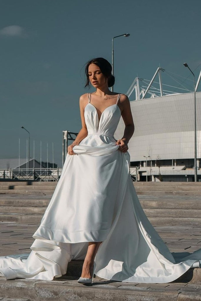 https://www.loveangeldress.com/cdn/shop/products/minimalist-white-wedding-dresses-with-plunging-neckline_1024x1024.jpg?v=1629453725